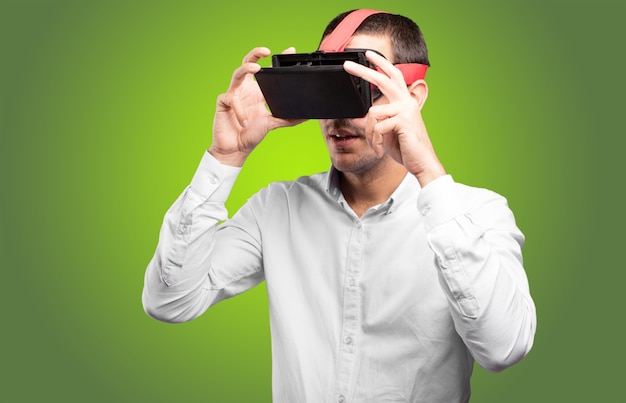 Young man using a virtual glasses