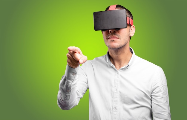 Young man using a virtual glasses