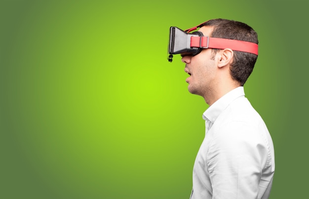 Young man using a virtual glasses