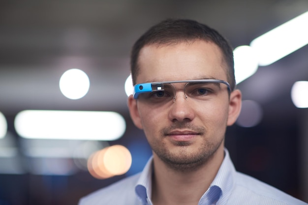 young man using virtual reality gadget computer technology glasses