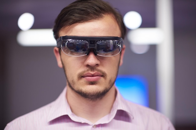 young man using virtual reality gadget computer technology glasses