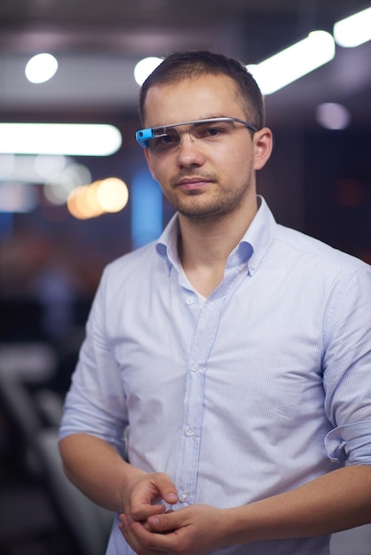 young man using virtual reality gadget computer technology glasses