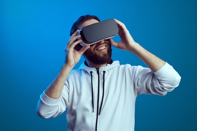 Young man using virtual reality headset vr future gadgets technology