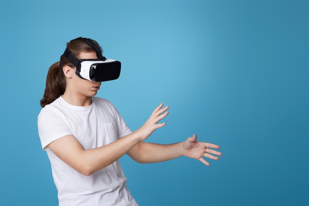 Young man using virtual reality headset. VR gadgets