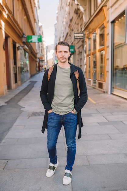 Premium Photo | Young man walking at the street