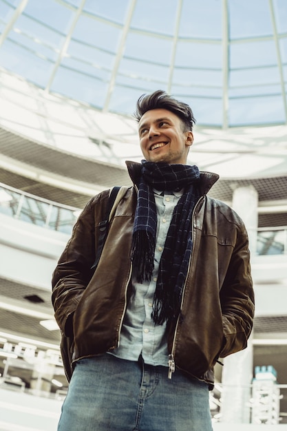 A young man walks around the city