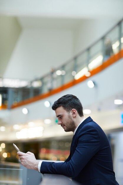 Young man wasting time in airport