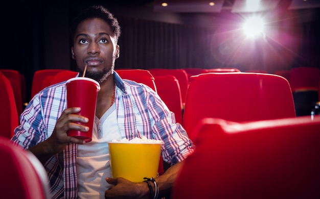 Young man watching a film