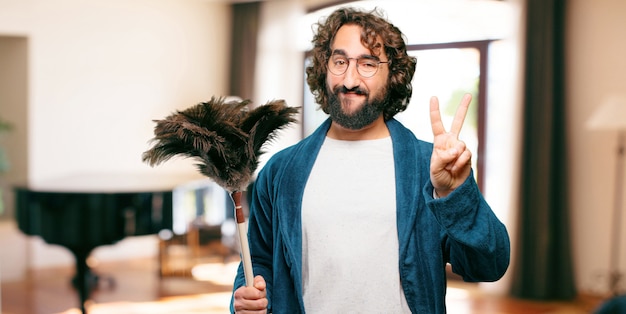 Photo young man wearing bathrobe night suit with a duster