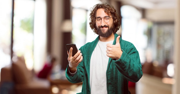 Young man wearing bathrobe night suit with a smart phone