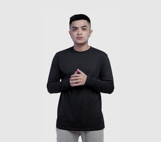 Young man wearing black long sleeve t shirt isolated on white