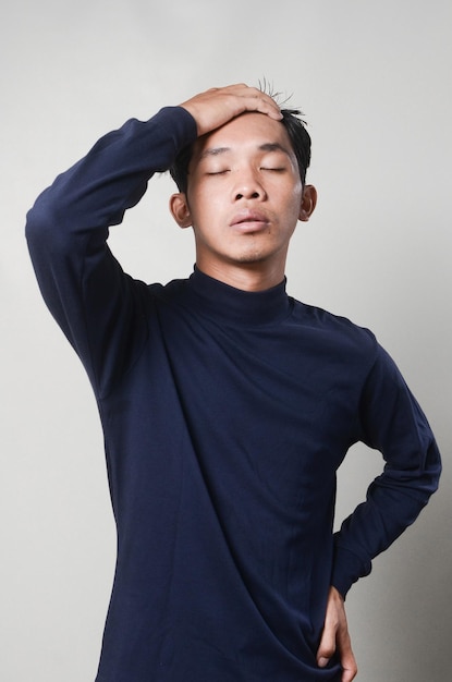 Young Man Wearing Blue Blank Turtleneck Shirt Posing Isolated Background