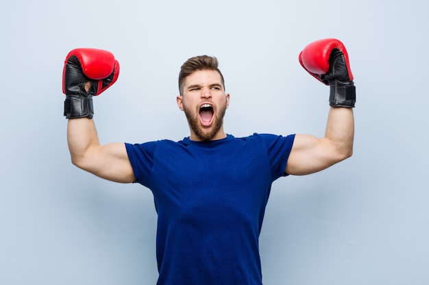 Young man wearing a boxing gloves