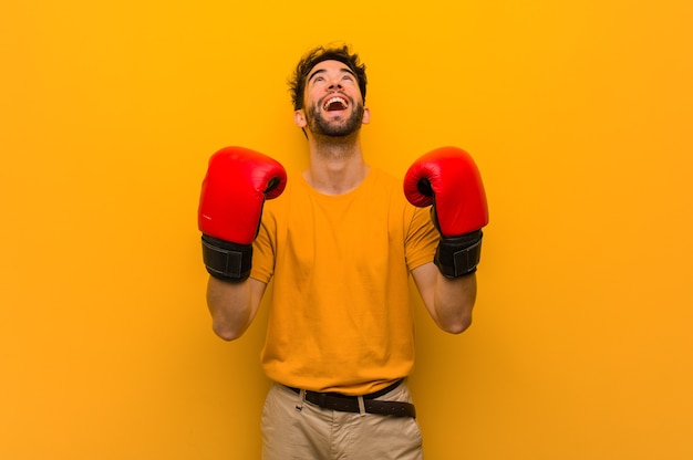 Young man wearing boxing gloves