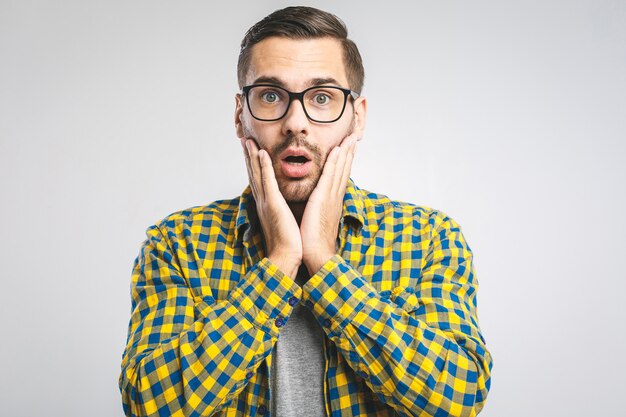 Young man wearing a casual shirt and eyeglasses