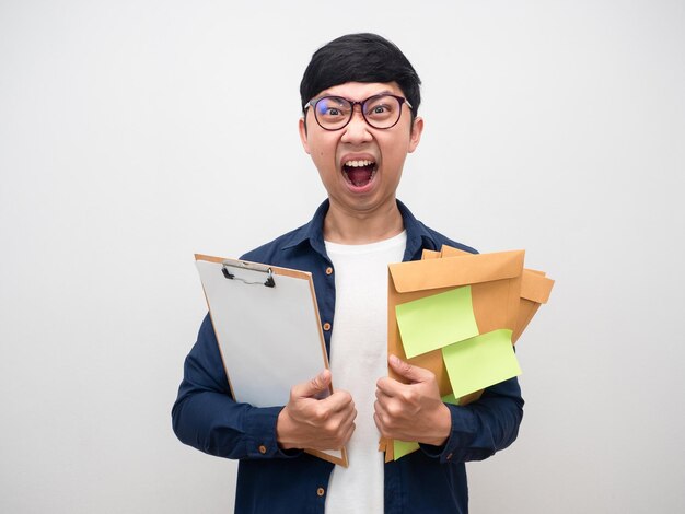 Young man wearing glasses tried with much work feel mad isolated