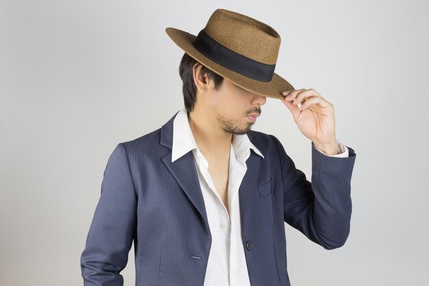 Young man wearing hat against white background