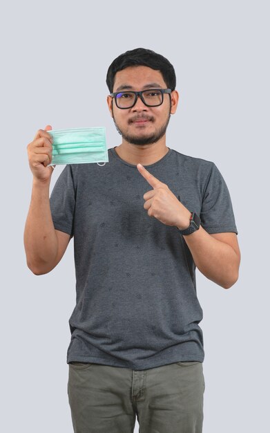 Young man wearing protective mask against Coronavirus