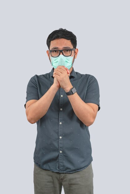 Young man wearing protective mask against Coronavirus