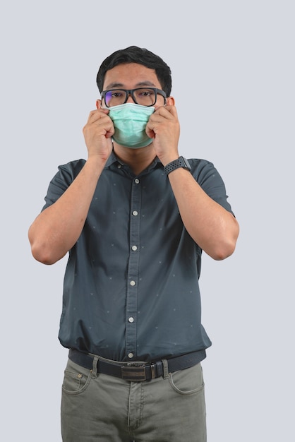 Young man wearing protective mask against Coronavirus