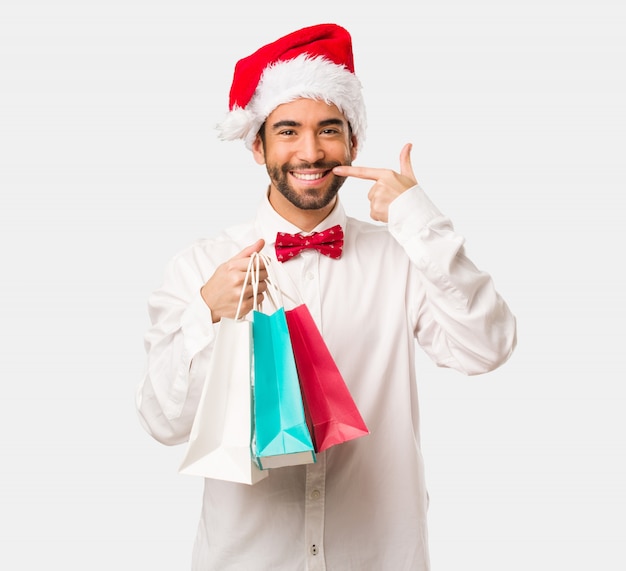 Young man wearing a santa claus hat on Christmas day