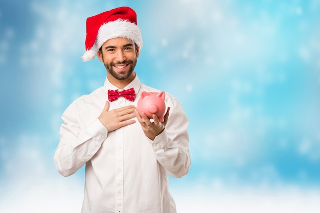 Young man wearing a santa claus hat on Christmas day