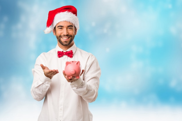 Young man wearing a santa claus hat on Christmas day