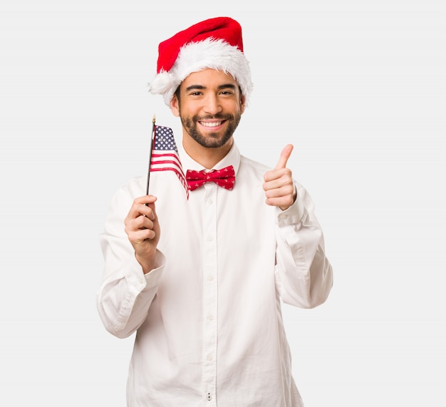 Young man wearing a santa claus hat on Christmas day