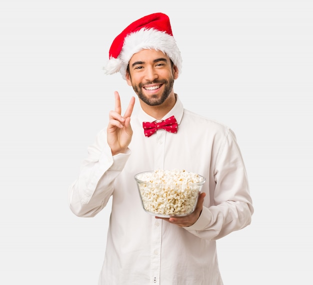 Young man wearing a santa claus hat on Christmas day