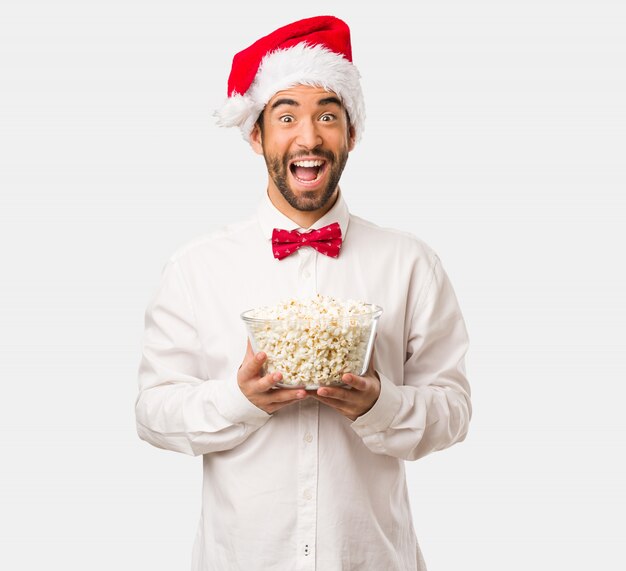 Young man wearing a santa claus hat on Christmas day