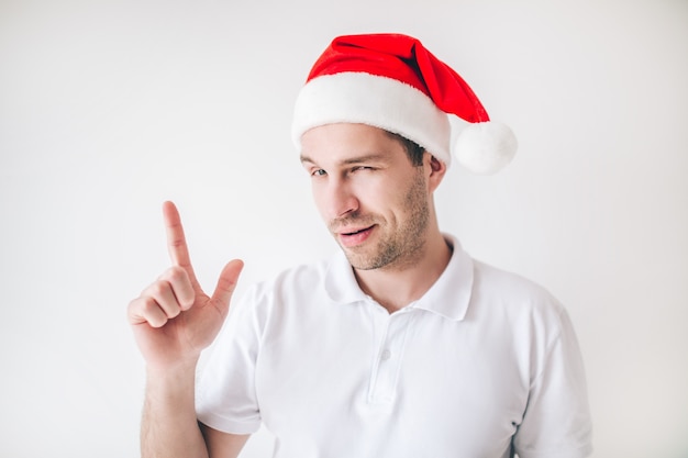 Young man wearing Santa hat close up