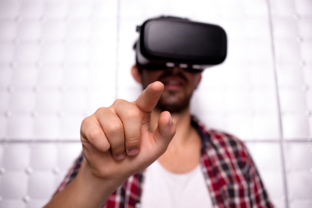 Young man wearing virtual reality glasses