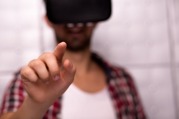 Young man wearing virtual reality glasses