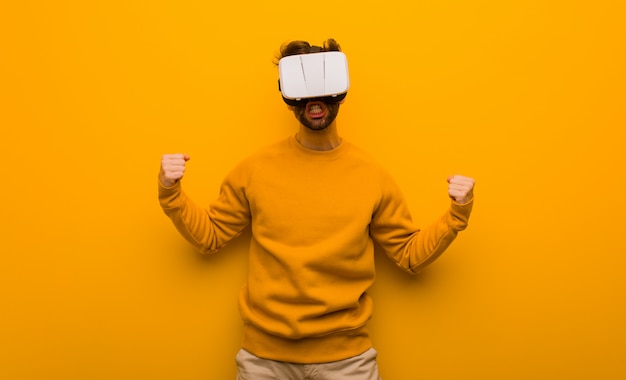 Young man wearing a virtual reality glasses