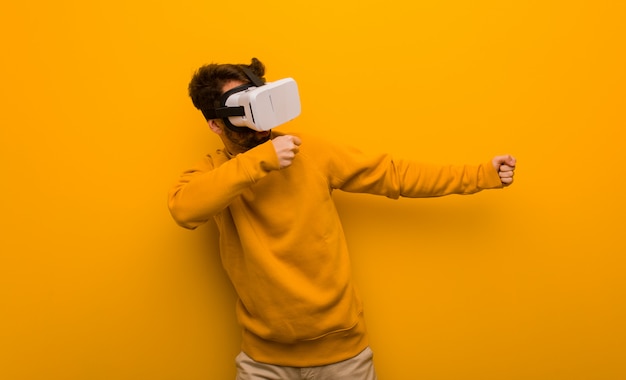 Young man wearing a virtual reality glasses