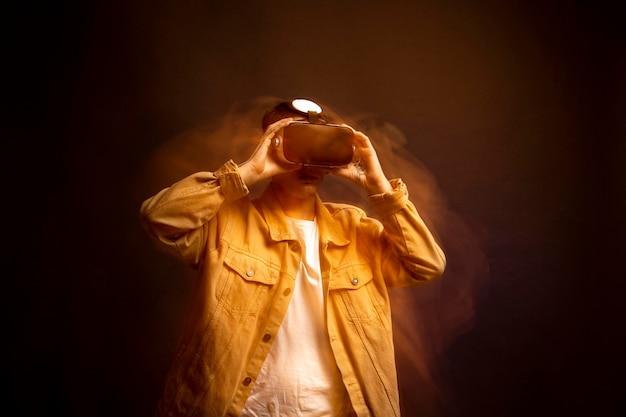 Young man wearing virtual reality goggles