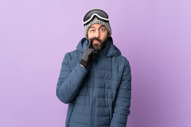 Young man wearing winter sport over isolated purple background