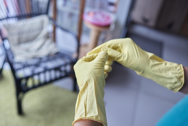 Young man wearing yellow rubber gloves Ready to cleaning