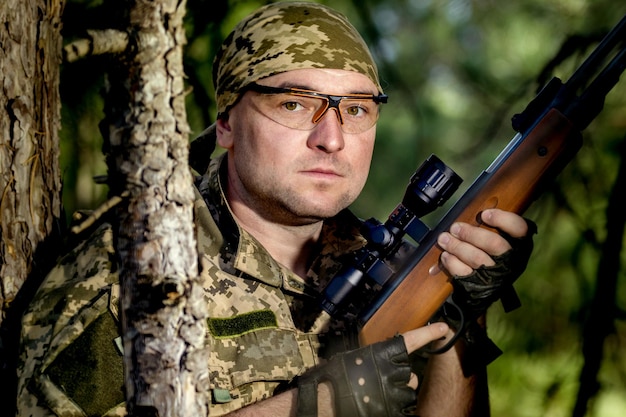 Young man with an air rifle