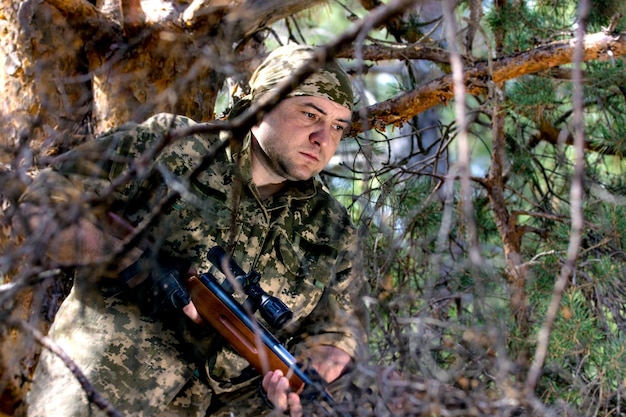 Young man with an air rifle