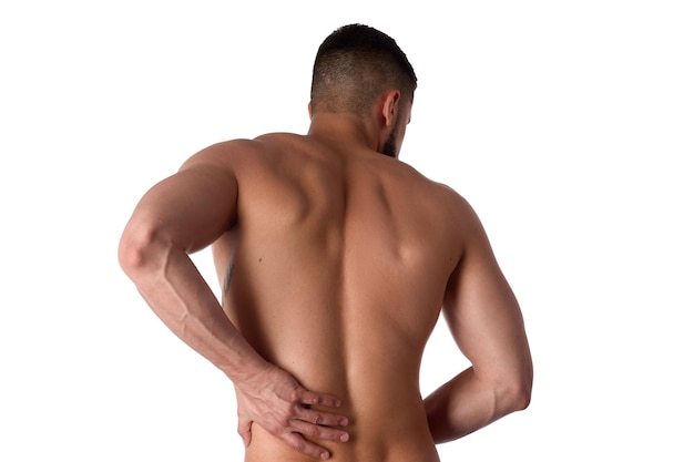 Young man with back pain the athlete clings to a sore back man hurt his back sports medicine concept