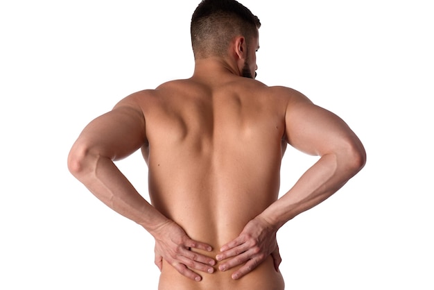 Photo young man with back pain the athlete clings to a sore back man hurt his back sports medicine concept