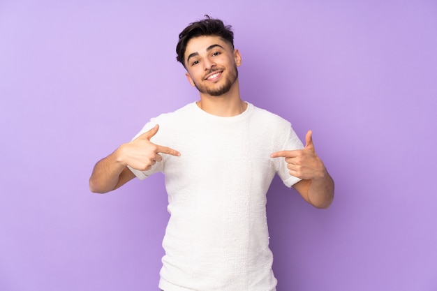 Young man with beard isolated on purple