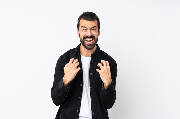 Young man with beard over isolated white wall frustrated by a bad situation