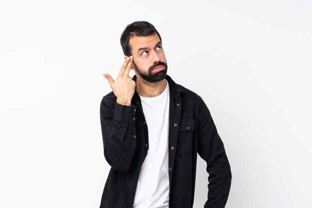 Young man with beard with problems making suicide gesture