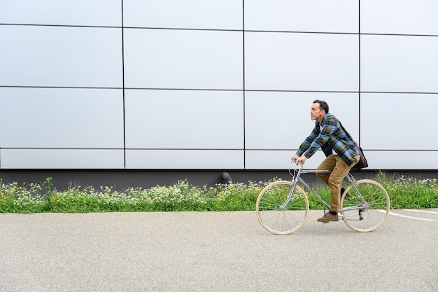 Young man with bicycle on street