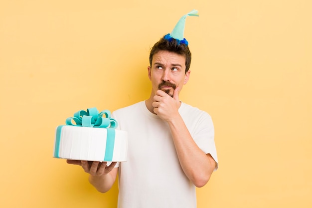 Young man with a birthday cake