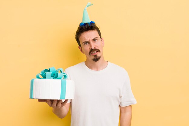 Young man with a birthday cake