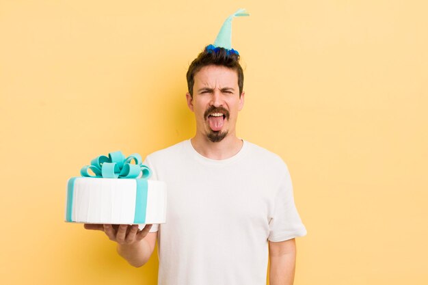 Young man with a birthday cake