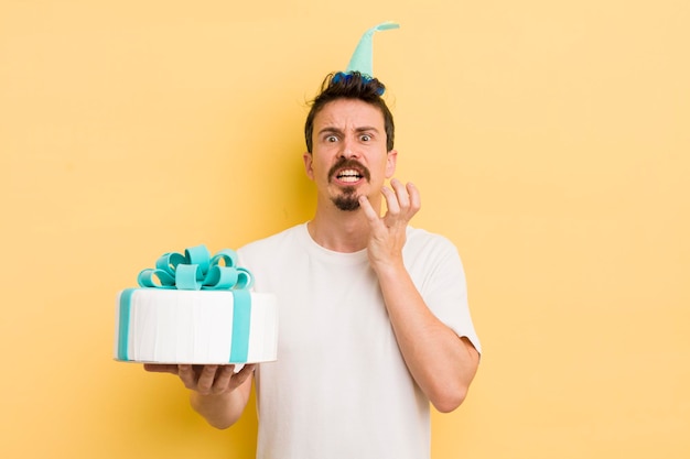 Young man with a birthday cake